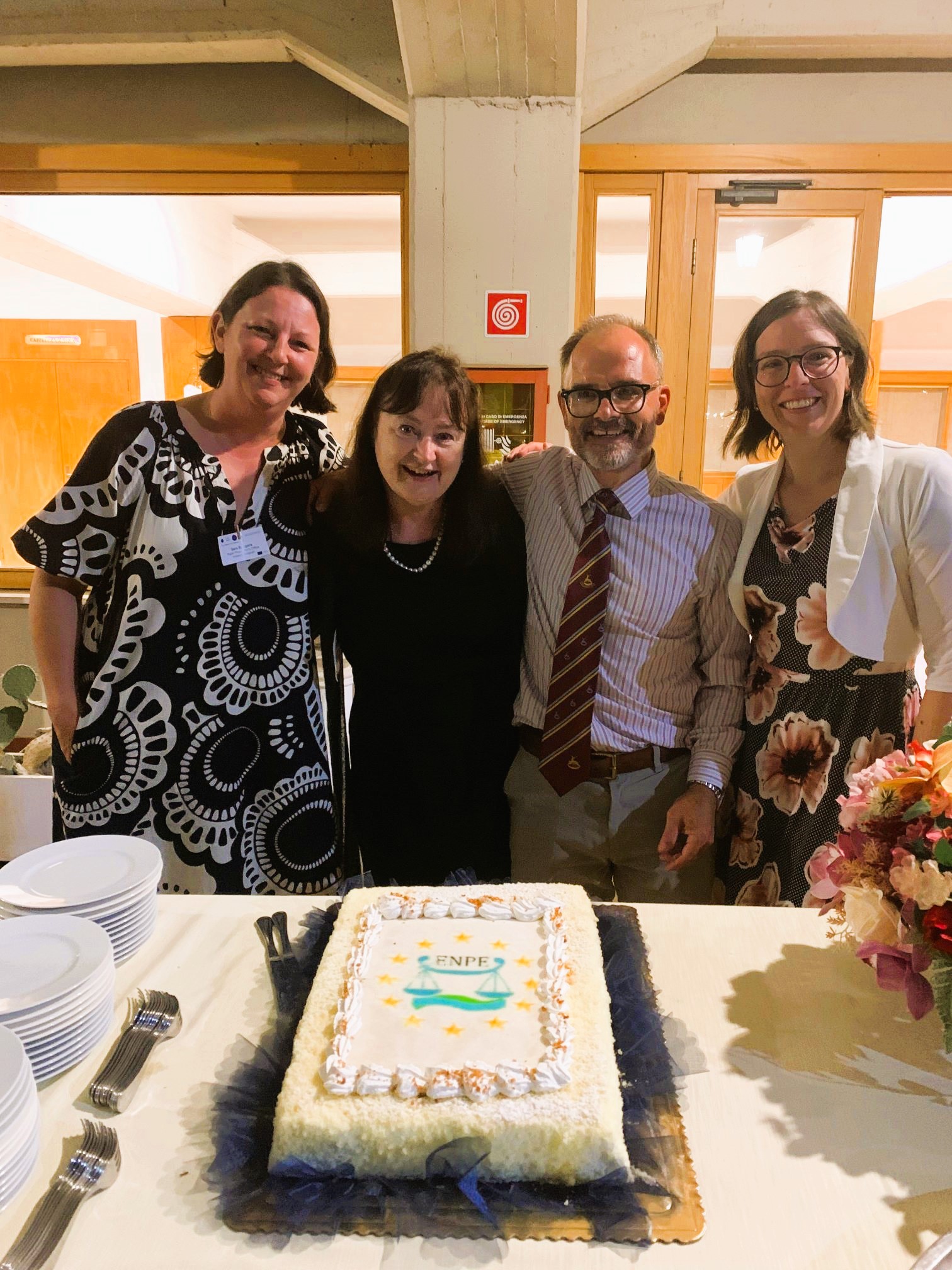 Colleagues and a birthday cake
